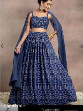 Blue lehenga set with embroidery and cape sleeves